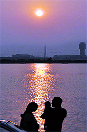A family enjoys sunset near Thermal lake in Bathinda on Sunday evening