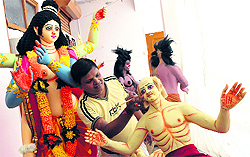 An artist gives final touches to a tableau at the Chaitanya Gaudiya Math in Bathinda on Sunday