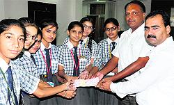 Students of Lord Rama Public School handed over a cheque for Rs 2 lakh for the Uttarakhand Relief Fund to the president of the school Trust and the principal in Bathinda