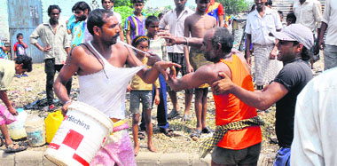 BJP and Congress workers clash during a protest held by the BJP against water shortage at Sanjay Colony in Chandigarh on Sunday.