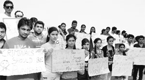 Members of Yuva Dharti protest against the Mumbai gang rape case at the Sukhna Lake on Sunday. 
