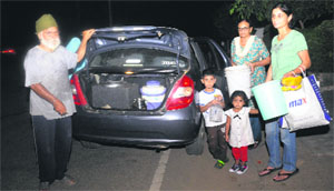 Sunita Saini, a resident of Phase X, Mohali, leaves for her relative's house in Sector 48, Chandigarh, along with her family to fetch water. 