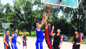 Players in action during the ongoing second Brother Kyle Basketball Tournament at Sector 26 in Chandigarh on Sunday.