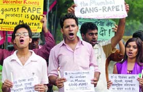Youth activists shout slogans during a demonstration under the banner of '16 December Kranti' against the gangrape of a photojournalist in Mumbai, at Jantar Mantar in New Delhi on Sunday