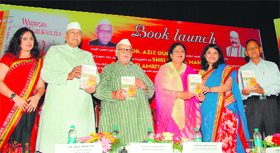 Governor Aziz Qureshi releases a book titled Warriors of Kurukshetra at Raj Bhavan in Dehradun on Sunday.