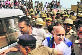 VHP leader Praveen Togadia being taken into custody from Gola Ghat in Ayodhya on Sunday. 