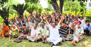 Members of the National Mazdoor Conference hold a protest in Jammu on Sunday.