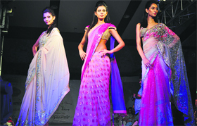 Wraparound sarees make for fashion and comfort. Exquisite cuts of blouses in bright colours to go with these create a stunning look.