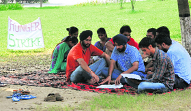 The protesting students of the College of Agricultural Engineering read their textbooks outside Thapar Hall in Ludhiana on Sunday.