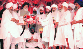 Organisers felicitate Punjab Chief Minister Parkash Singh Badal near Mandi Ahmedgarh on Sunday.