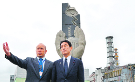 Fumio Kishida (R), Foreign Minister of Japan, meets Igor Gramotkin, general manager of the Chernobyl plant, during a visit on Sunday. Kishida travelled to Chernobyl to compare notes on relief efforts following Japans own disaster at Fukushima. 