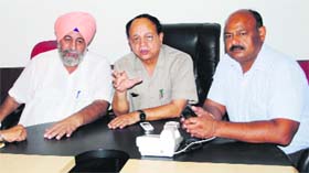 Mayor Bakshi Ram Arora (centre) addresses a press conference in Amritsar on Monday