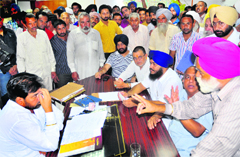 Villagers argue with Mayor Subhash Chawla over the impounding of cattle at his office in Chandigarh on Monday. Tribune photo: S Chandan
