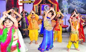 Children dressed as Radha and Krishna present a dance item as part of the Janmashtami celebrations at Sanskriti Play School in Haridwar on Monday