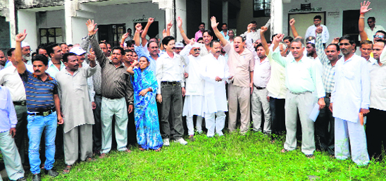 Members of the Jan Sangharsh Morcha hold a protest at Vikasnagar on Monday against privatisation of quarrying of minerals. Tribune photo