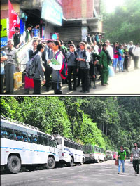 People wait for buses and (below) private buses parked along a roadside in Shimla on Monday. 