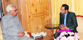 Governor NN Vohra with a member of the Sopore Welfare and Development Forum at Raj Bhawan in Srinagar on Monday.