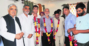 PDP patron Mufti Mohammad Sayeed welcomes new entrants into the party fold at a function in Jammu on Monday.