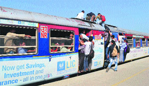 The overcrowded Baramulla-Banihal train at the Anantnag railway station on Monday.