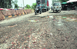 A dilapidated strech of the Guru Nanak Pura-Ladowali road.