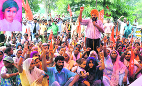 A labour union protests outside the Police Commissioners office in Ludhiana on Monday. (Inset) file photo of Nancy.