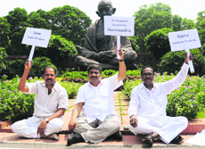 Suspended TDP MPs protest at Parliament House in New Delhi on Monday during the ongoing monsoon session. 
