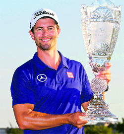 Adam Scott poses after winning the Barclays PGA tournament.