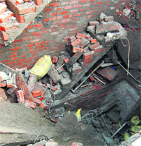 The debris of the roof of an under-construction house that collapsed killing two labourers in Guru Arjun Dev Nagar on the Tarn Taran road in Amritsar on Tuesday.