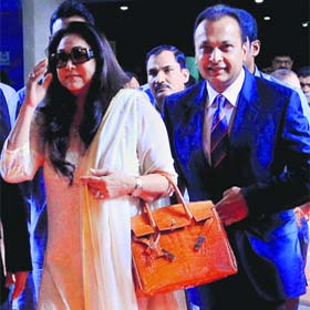 Industrialist Anil Ambani along with his wife Tina Ambani arrives for the Reliance Capital AGM in Mumbai on Tuesday