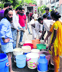 A Fire Brigade vehicle supplies water to residents of Phase IX in Mohali on Tuesday