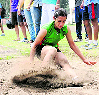 An athlete takes part in the long jump event in the ongoing Chandigarh State Athletics Championship at the Sports Complex, Sector 7, in Chandigarh on Tuesday