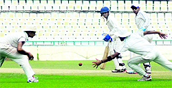 Players in action during a cricket match at the PCA Stadium, Phase IX, in Mohali on Tuesday