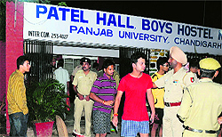 The police nabs outsiders during a raid at boys hostel No. 4 on the PU campus on Tuesday