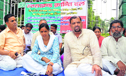 Workers of the Uttarakhand Kranti Dal (Panwar) hold on a dharna at Gandhi Park on Tuesday against the deteriorating law and order situation in the state.