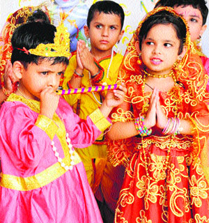 Students celebrate Krishna Janmashtami at a school in Karnal on Tuesday. 