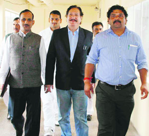 BJP legislators walk out of the Vidhan Sabha in Shimla on Tuesday. 