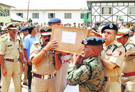The coffin of the slain CRPF jawan being carried by police and CRPF officers on Tuesday.