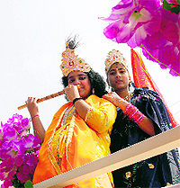 Children dressed as Lord Krishna and his consort Radha take part in celebrations to mark Janmashtami in Srinagar