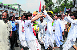 Kashmiri pandits during the religious procession on the occasion of Janmashtami celebrations at Lal Chowk in Srinagar on Tuesday