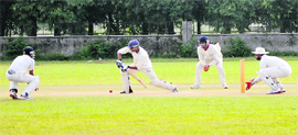 A batsman takes a defensive stance during a tie of the Punjab State Inter-District Cricket Tournament for Katoch Shield at the PAU in Ludhiana. 