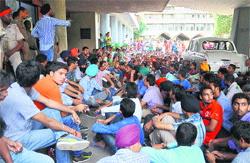 Students sitting outside the Vice-Chancellor's office.