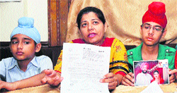 Bhupinder Kaur flanked by her sons addresses mediapersons at a restaurant near Sarabha Nagar in Ludhiana on Tuesday.