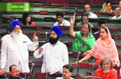 From right: Agitated Akali MPs Harsimrat Kaur Badal, Parmjit Kaur Gulshan (in green suit), Sher Singh Ghubaya and Rattan Singh Ajnala in the Lok Sabha on Tuesday. PTI