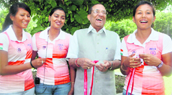 The triumphant Indian archery team with VK Malhotra during a felicitation function in New Delhi .  PTI