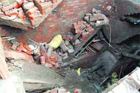 The debris of the roof of an under-construction house that collapsed killing two labourers in Guru Arjun Dev Nagar on the Tarn Taran road in Amritsar on Tuesday