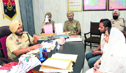 SSP Ravcharan Singh Brar speaks to Ranjit Kaur at his office in Bathinda. Tribune photo: Pawan Sharma