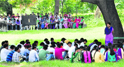 Students attend classes in the open at Government Rajindra College in Bathinda. Tribune photo: Pawan Sharma