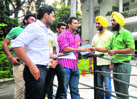 SOPU workers during a door-to-door canvassing at a student's residence in Sector 15, Chandigarh, on Wednesday.