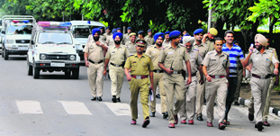 The police holds a flag march at Panjab University on Wednesday.