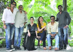 Bollywood director Prakash Jha (2nd-L) and actors Arjun Rampal, Amrita Rao, Kareena Kapoor, Manoj Vajpayee and Ajay Devgan pose for the photoshoot for the promotion of their upcoming movie 'Satyagraha' which is set to be released on August 30, in New Delhi on Wednesday